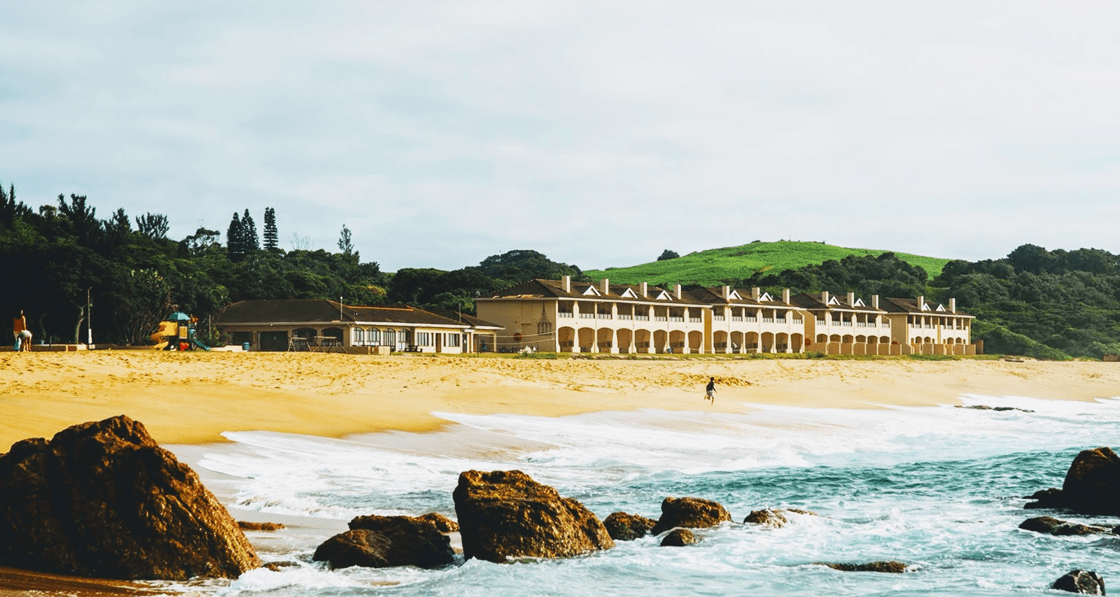 A picture of the Happy Wanderers resort taken from the beach.